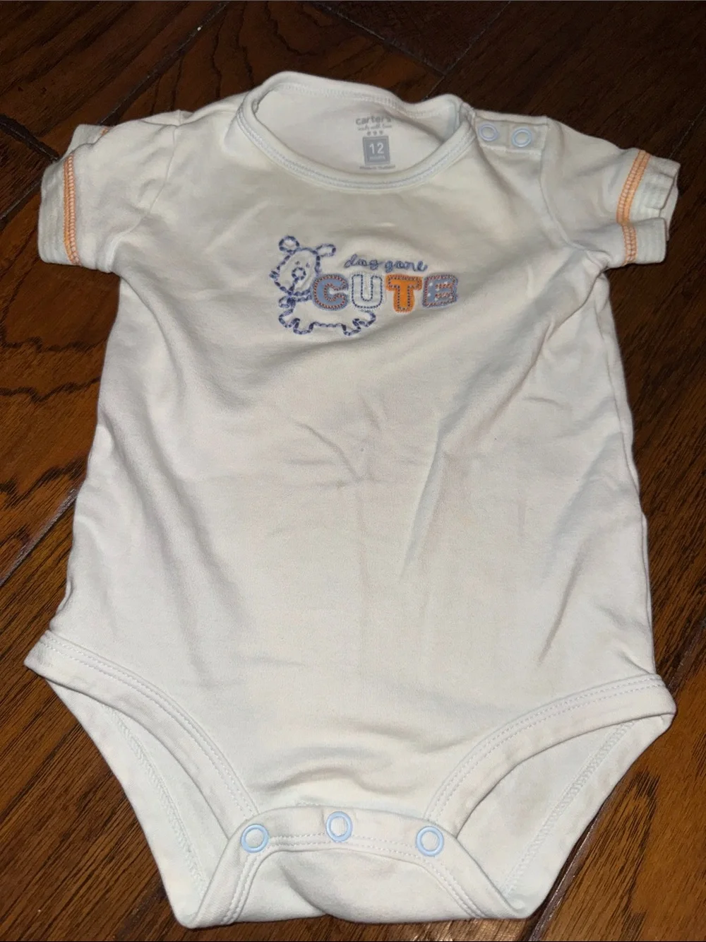 Baby Short-Sleeve One-Piece Bodysuit and a blue zipper sweater